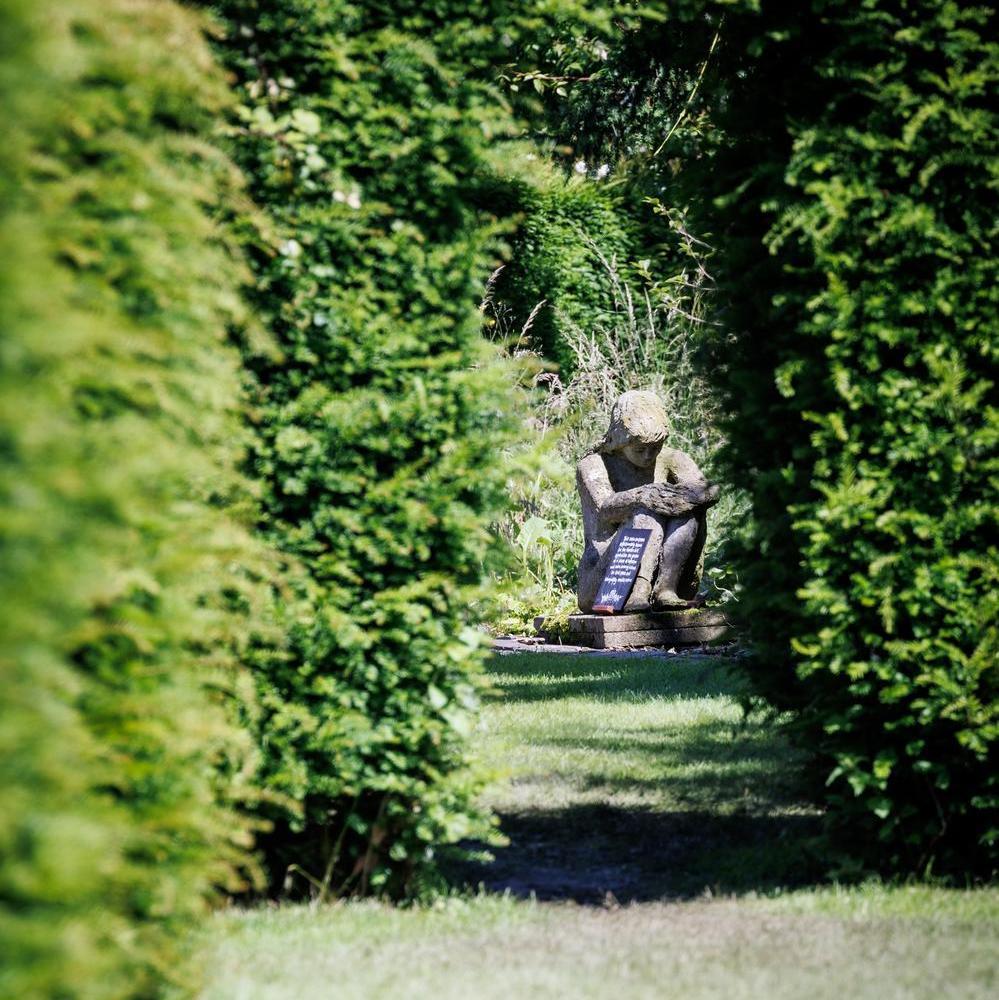 Stone sculpture designed by Pat Austin, David Austin's wife, in their home and gardens in Shropshire.