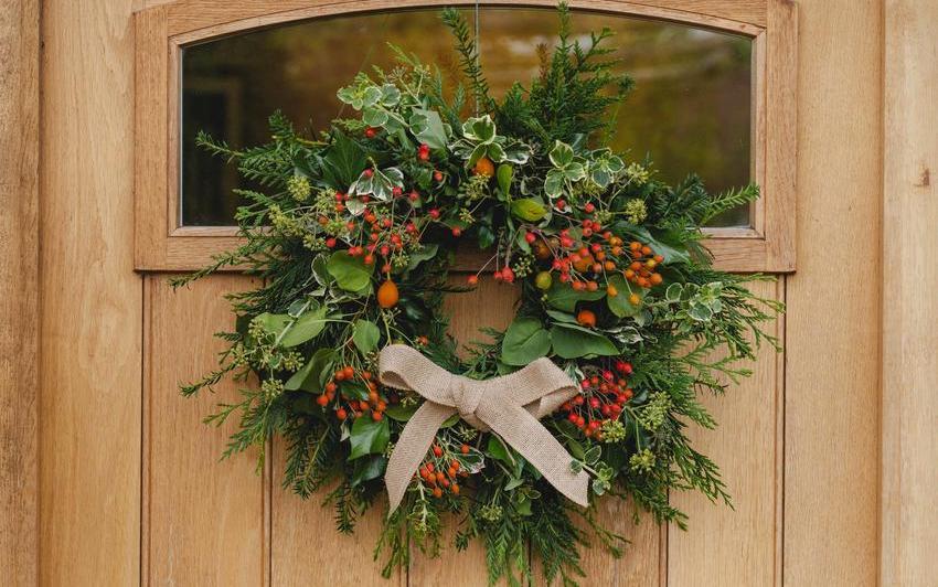 Rose hip wreath hanging on a door