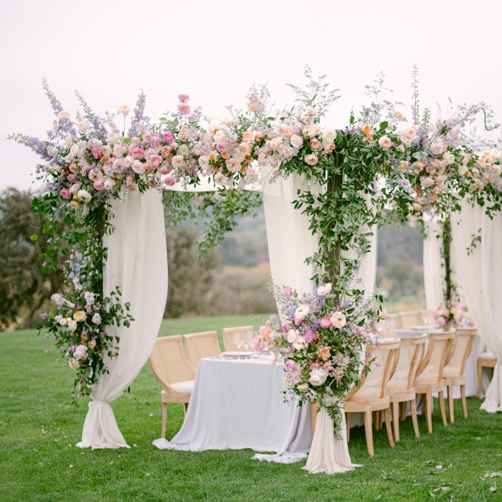 A display of David Austin wedding roses on a outdoors structure